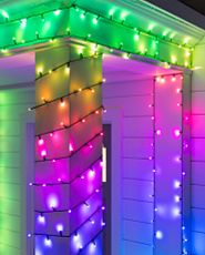 Colored Twinkly light string on a porch column