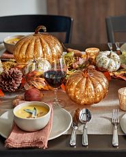 Glass pumpkins on Thanksgiving table